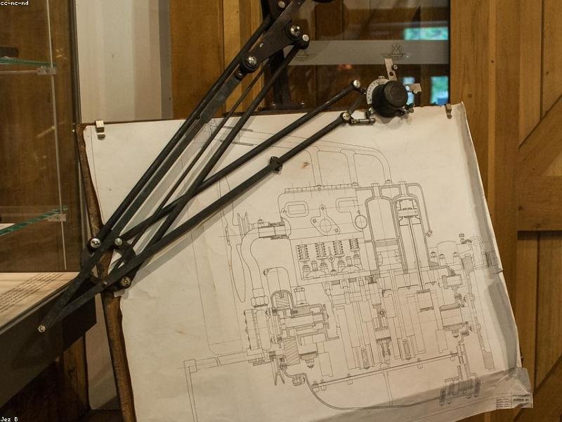 Technical engineering drawing on a professional drafting table
